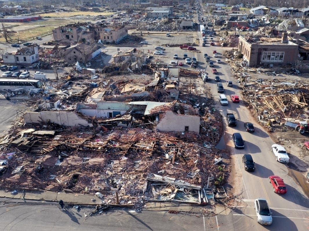 In this aerial view, homes and businesses are destroyed after a tornado ripped through town the previous evening on December 11, 2021 in Mayfield, Kentucky.