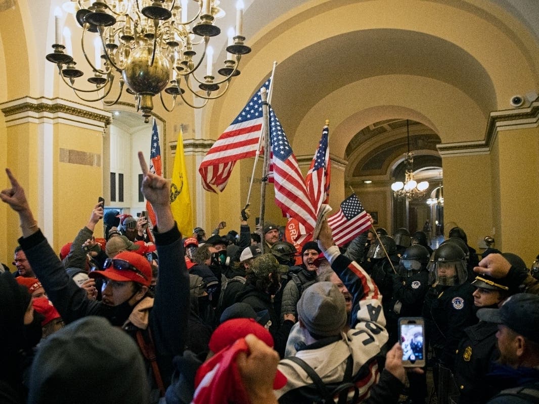 Supporters of US President Donald Trump protest inside the US Capitol on January 6, 2021, in Washington, DC. Demonstrators breached security and entered the Capitol as Congress debated the 2020 presidential election Electoral Vote Certification.