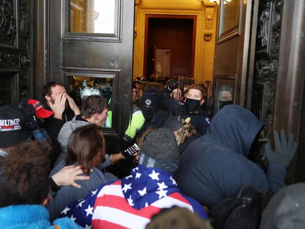 Protesters gather at the door of the U.S. Capitol Building on Jan. 6. Pro-Trump rioters entered the U.S. Capitol building after mass demonstrations in the nation's capital during a joint session Congress to ratify President-elect Joe Biden's 306-232 Elect