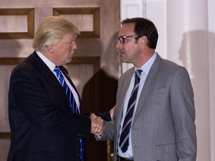 Donald Trump, then president-elect, shakes hands with Chicago Cubs co-owner Todd Ricketts after a Nov. 19, 2016, meeting at Trump International Golf Club in New Jersey. 