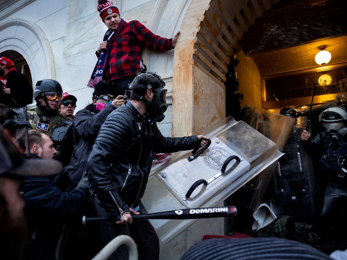Supporters of former President Donald Trump storm the US Capitol on Jan. 6 in Washington, DC. Demonstrators breached security and entered the Capitol as Congress debated the certification of the 2020 electoral college vote.