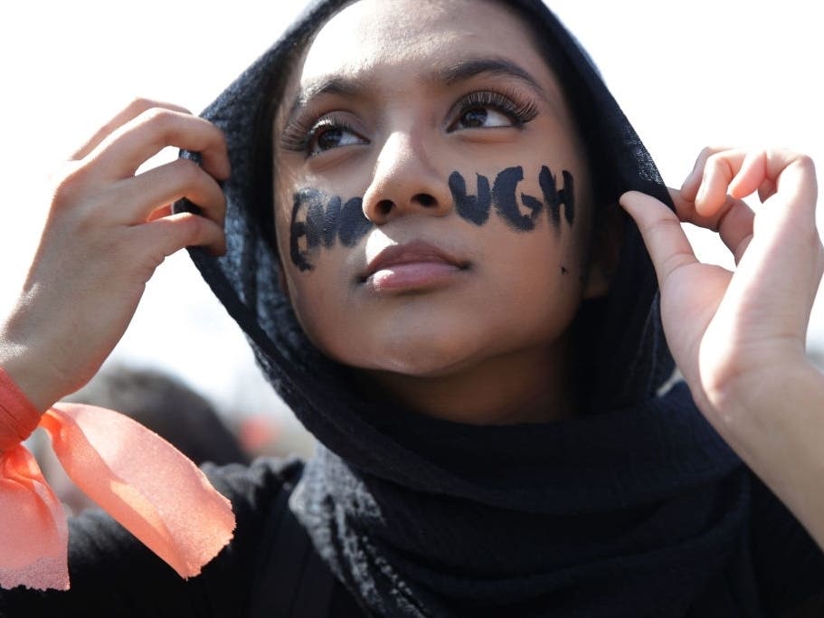A high schooler participates in a gun control rally at the West Front of the U.S. Capitol March 14, 2019.