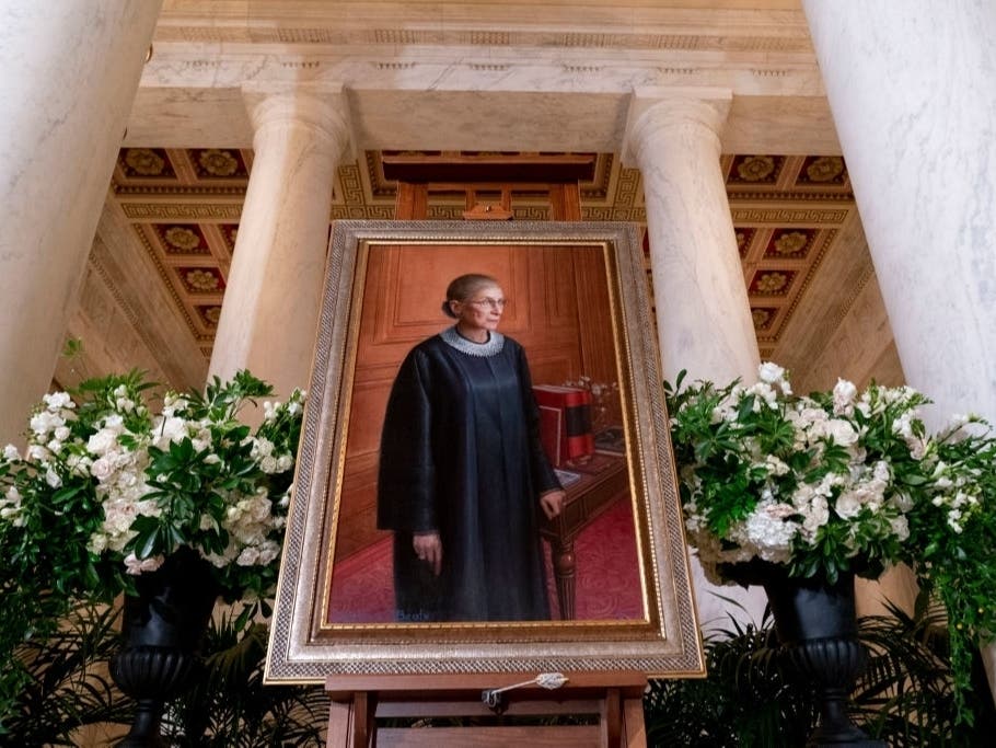 A 2016 portrait of Associate Justice Ruth Bader Ginsburg is displayed in the Great Hall following a private ceremony for her at the U.S. Supreme Court on Sept. 23.