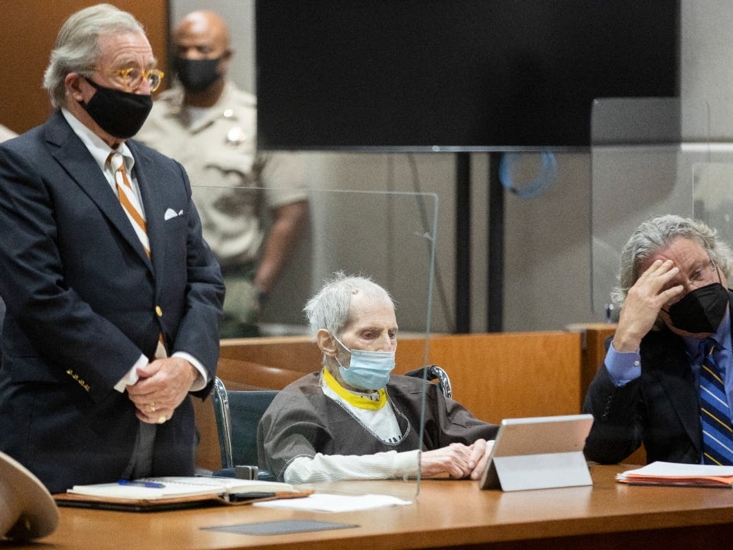 Robert Durst (C), sits with defense attorneys Dick DeGuerin (L) and David Chesnoff, during his sentencing on October 14, 2021 in Los Angeles, California. Durst was sentenced to life without the possibility of parole for the 2000 murder of Susan Berman.