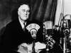 circa 1935: American politician and the 32nd President of the United States, Franklin Delano Roosevelt (1882 - 1945) delivering one of his fireside chats to the nation.