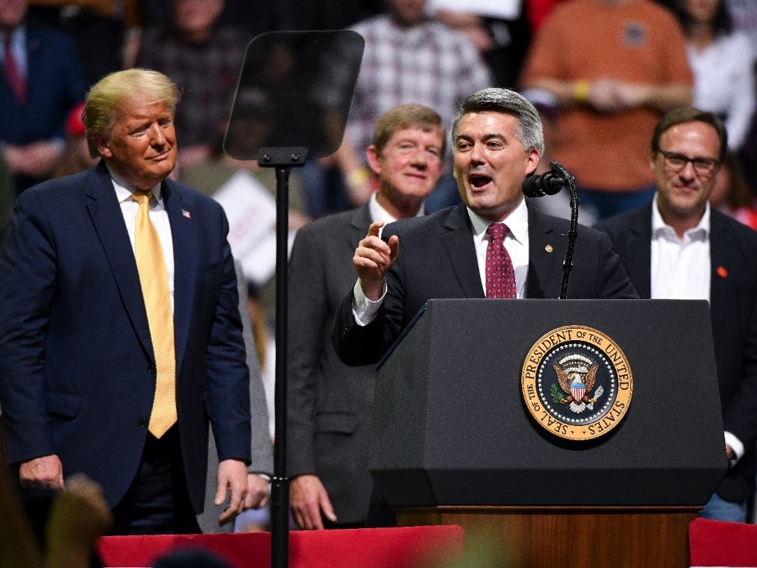 U.S. Sen. Cory Gardner (R-CO) speaks with President Donald Trump on stage during a Keep America Great rally in February in Colorado Springs. While both lost in Colorado, there are many local counties where they came out far ahead.