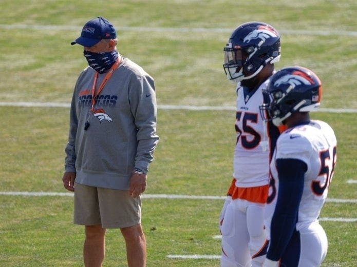Broncos' head coach Vic Fangio stands near linebacker Bradley Chubb #55 and linebacker Von Miller #58 during a training session at UCHealth Training Center Aug. 18. The team has been forced to halt in-person fan games amid climbing COVID-19 rates.