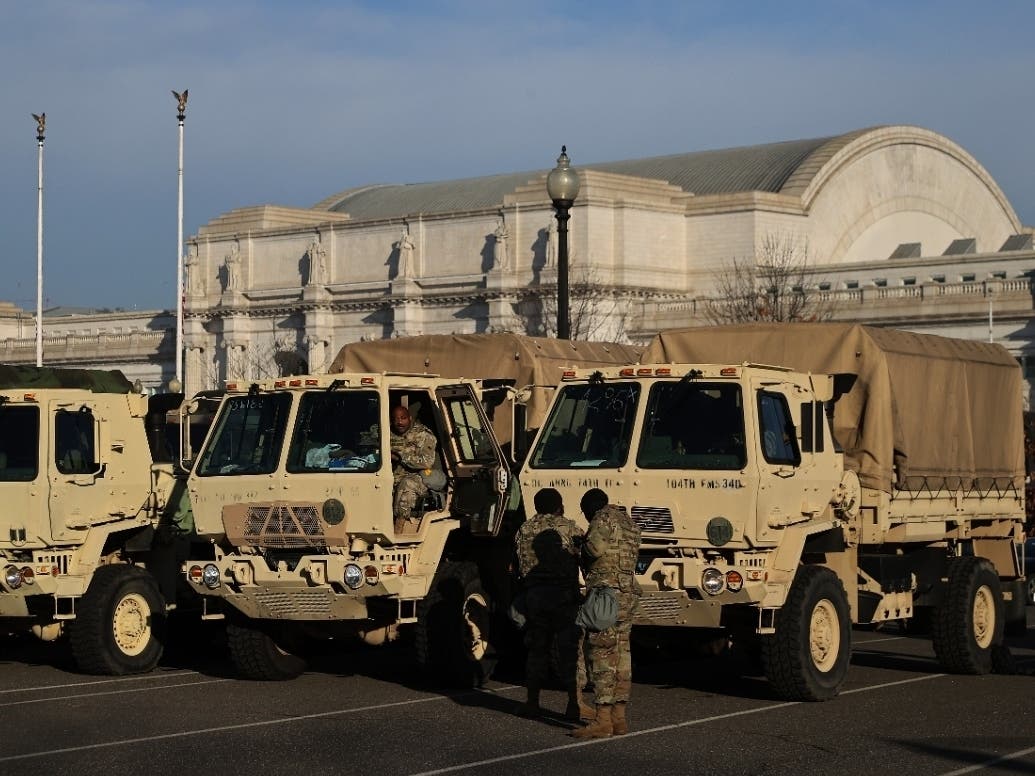 National Guard trucks are parked in a lot in between the U.S. Capitol and Union Station Jan. 13 in Washington, DC.