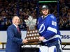 Goalie Andrei Vasilevskiy is presented with the Conn Smythe Trophy for most valuable player by NHL Commissioner Gary Bettman after defeating the Montreal Canadiens 1-0 to win the 2021 NHL Stanley Cup. 