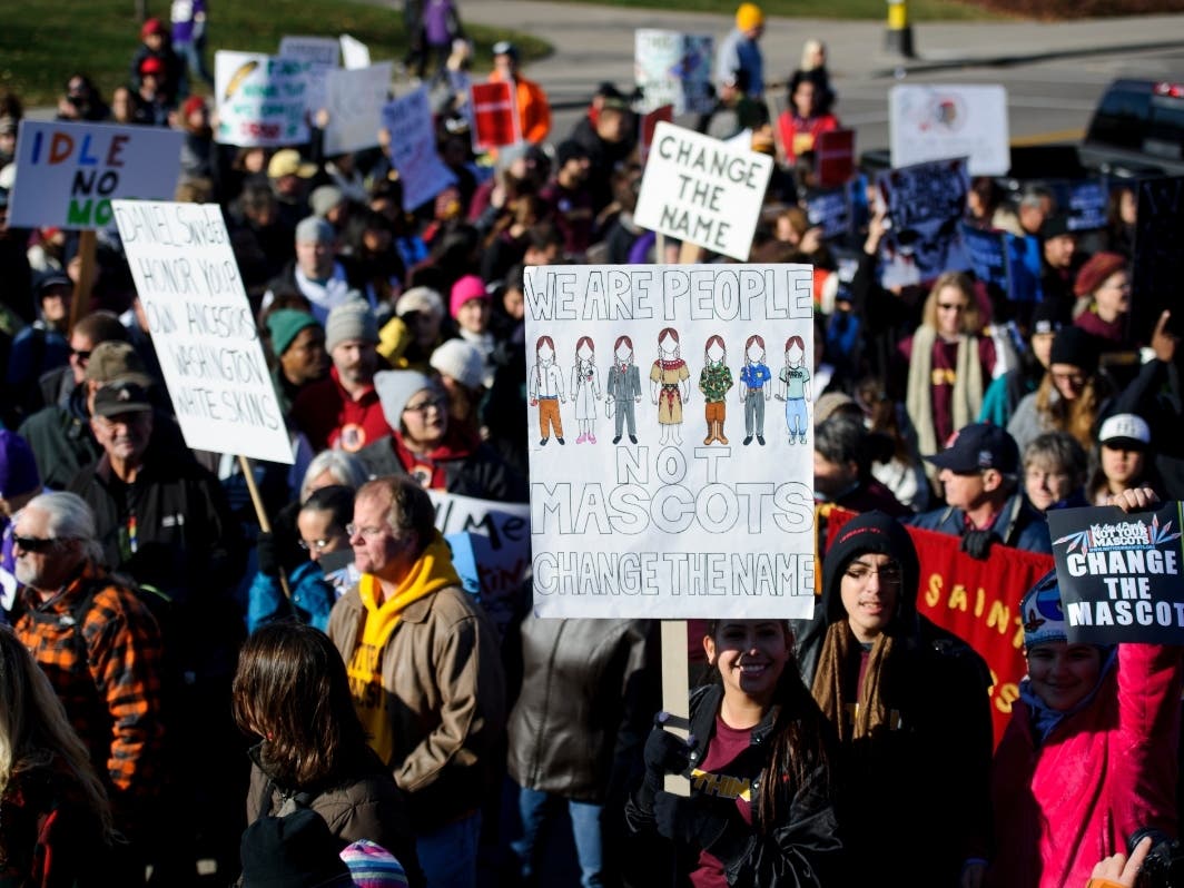 People march to TCF Bank Stadium to protest against the mascot for the Washington Redskins before the game against the Minnesota Vikings on November 2, 2014 at TCF Bank Stadium in Minneapolis, Minnesota.