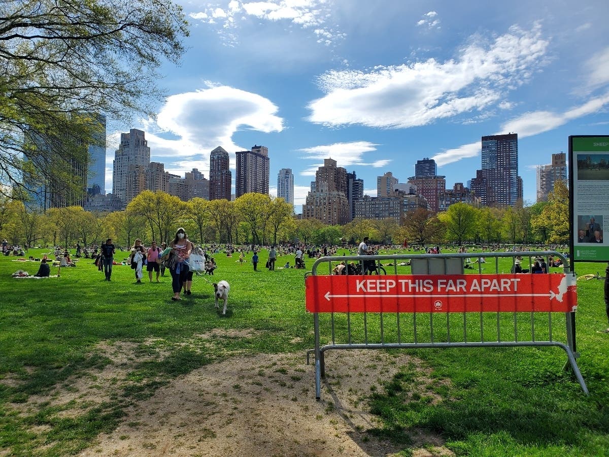 People fill Sheep Meadow in Central Park during the coronavirus pandemic on May 2, 2020 in New York City. COVID-19 has spread to most countries around the world, claiming over 244,000 lives with over 3.4 million infections reported.