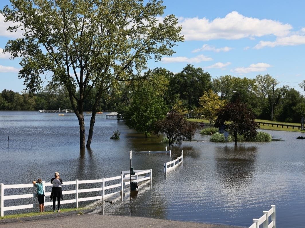 Residents look at a flooded Lincoln Park Community Lake on Sept. 2 after the remnants of Hurricane Ida passed through New Jersey.
