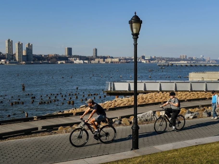 People cycling along the Hudson River in New York City on Feb. 21, 2018.