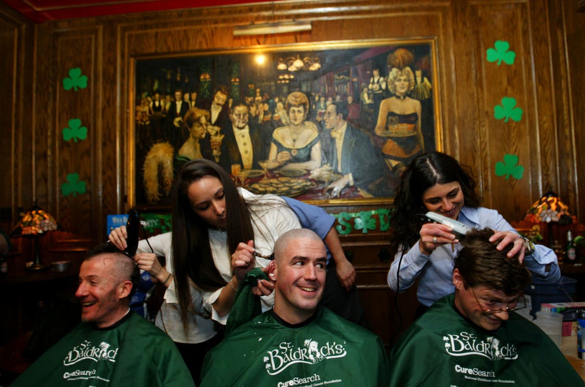 Men get their heads shaved during a St. Baldrick's Day event at a pub in New York City. 