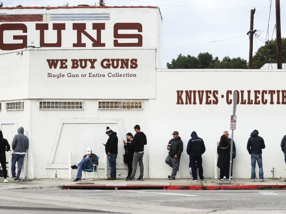 People stand in line outside the Martin B. Retting, Inc. guns store on March 15, 2020 in Culver City, California. The spread of Coronavirus (COVID-19) has prompted some Americans to line up for supplies in a variety of store.