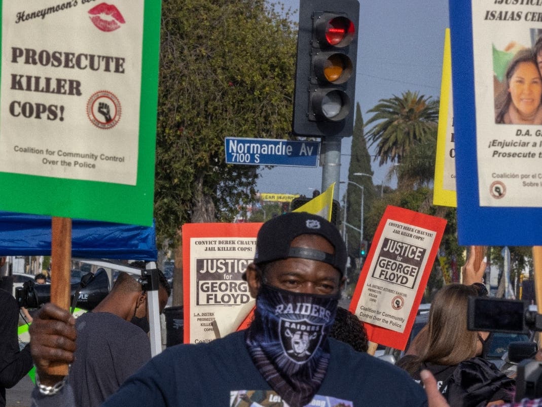 LOS ANGELES, CA - APRIL 12: People gather at the intersection of Florence and Normandie to protest the fatal police shooting of Daunte Wright in Brooklyn Center, Minnesota, on April 12, 2021 in Los Angeles, California.