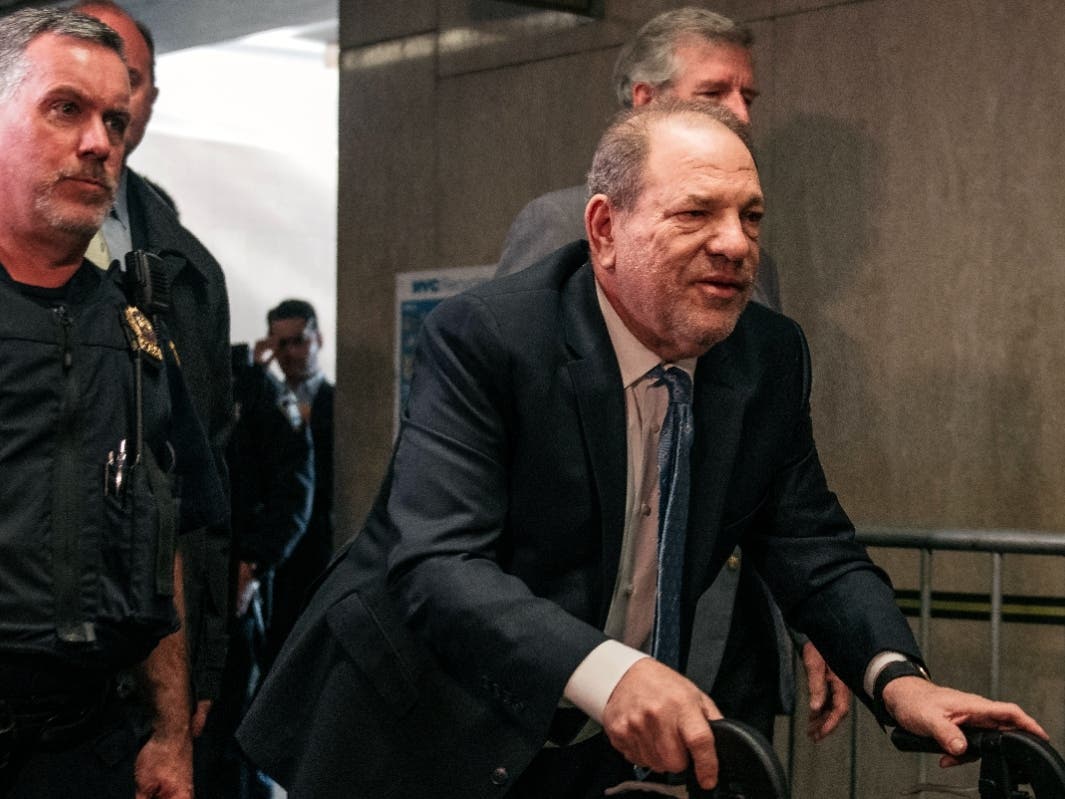 Movie producer Harvey Weinstein (R) enters New York City Criminal Court on February 24, 2020 in New York City. 