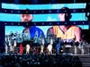 Images for the late Nipsey Hussle and Kobe Bryant are projected onto a screen while (L-R) YG, John Legend, Kirk Franklin, DJ Khaled, Meek Mill, and Roddy Ricch perform onstage during the 62nd Annual GRAMMY Awards at STAPLES Center on January 26, 2020.