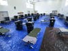 Beds are set up in a soon to be opened emergency shelter for the homeless in a recreation center as the coronavirus spread continues on March 23, 2020 in Los Angeles, California. 