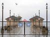 A sign explaining the closure of the Huntington Beach Pier is seen on March 24, 2020 in Huntington Beach, California.
