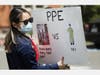 A nurse holds a sign to protest the lack of personal protective gear available at UCI Medical Center amid the coronavirus pandemic on April 3, 2020 in Orange, California. 