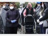 People wait in line to receive food at a Los Angeles Regional Food Bank distribution for those in need, as the coronavirus pandemic continues, on April 9, 2020 in Van Nuys, California.