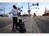 Maestro the Vocalinist performs while wearing a face mask at an intersection at dusk amidst the coronavirus pandemic on April 21, 2020 in Los Angeles, California. He said he performs there three to four times per week. 