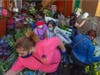 People mingle close to one another as businesses in the flower district in Skid Row reopen in time for Mother's Day on May 8, 2020 in Los Angeles, California. 