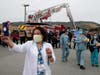 A nurse takes a selfie in front of firefighters who are lined up to thank front line workers at Kaiser Hospital on May 14, 2020 in South San Francisco, California.