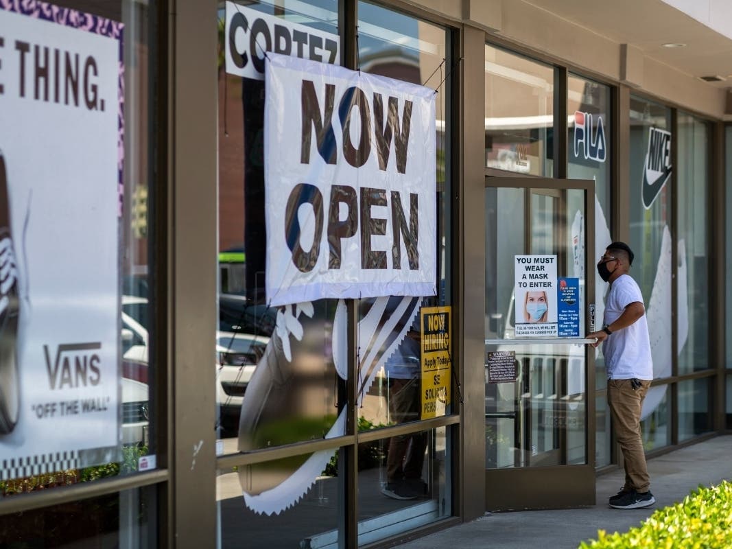 A man enters a Shoe City store as Los Angeles County retail businesses reopen while the COVID-19 pandemic continues on May 27, 2020 in Glendale, California.