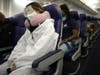 A passenger wears personal protective equipment (PPE) while aboard a Southwest Airlines flight from Los Angeles, CA to Houston, TX on June 7, 2020. All passengers were required to wear face coverings and middle seats were left open for social distancing.