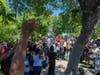 People demonstrate near the tree that authorities say Robert Fuller, a 24-year-old black man, was found hanging dead from near Palmdale City Hall on June 13, 2020 in Palmdale, California.