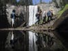 Visitors hike up the Mist Trail toward Vernal Fall on June 19, 2020 in Yosemite National Park, California. Yosemite National Park reopened June 11 with many restrictions after shutting down in March in response to the COVID-19 pandemic.