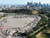 An aerial view of people in cars lined up to be tested for COVID-19 in a parking lot at Dodger Stadium amid the coronavirus pandemic on June 26, 2020 in Los Angeles, California