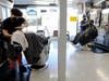 Barbers wear face masks as they work in the Hollywood Barber Shop shortly before closing amid new restrictions due to the COVID-19 pandemic on July 13, 2020 in Los Angeles, California.