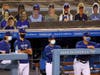 (R-L) Bob Geren #8, Manager Dave Roberts #30, Mark Prior #23 and Danny Lehmann watch the final out of the game in front of cutout fan faces, in a preseason win over the Arizona Diamondbacks at Dodger Stadium on July 20, 2020 in Los Angeles.