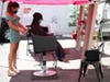 Insignia Hair Salon stylist Regina Muslimova (L) gives Poh Teng (R) a haircut in the parking lot behind the salon on July 21, 2020 in Walnut Creek, California.