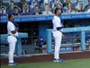 Manager Dave Roberts #30 of the Los Angeles Dodgers stands for the national anthem before the game against the San Francisco Giants at Dodger Stadium on July 26, 2020 in Los Angeles, California.