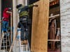 Workers board up a Fendi store in anticipation of unrest related to the presidential election on November 2, 2020 in New York City.