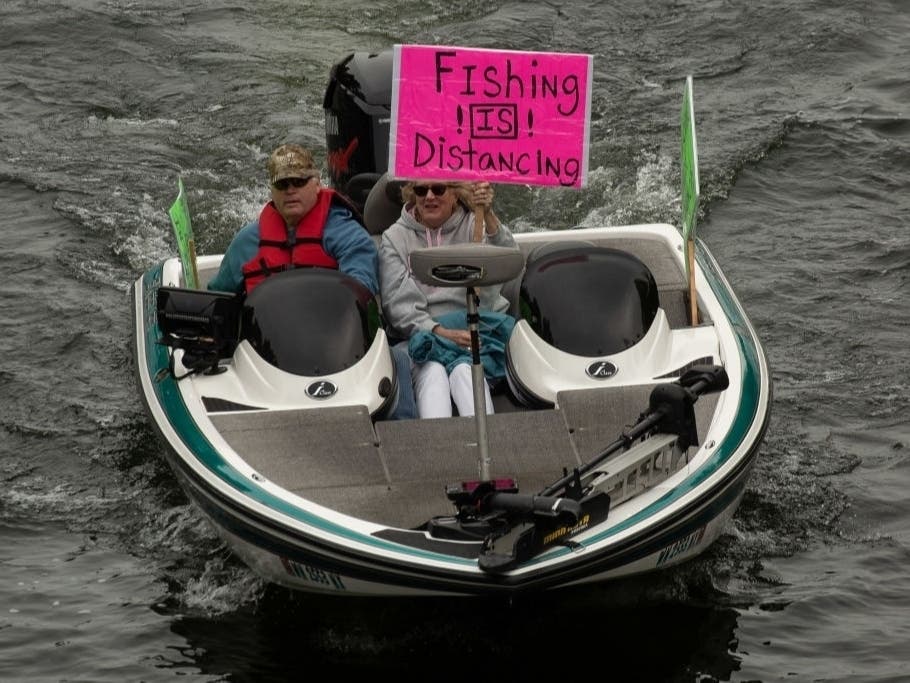 People take part in a "Let Us Fish" protest and rally April 26, 2020 on Lake Union in Seattle.