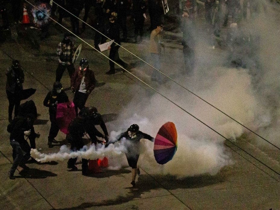 Demonstrators clash with police near the Seattle Police Departments East Precinct shortly after midnight on June 8, 2020 in Seattle, Washington.