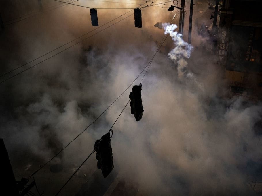 A gas canister flies back toward police as gas fills the air during clashes between demonstrators and police near the Seattle Police Department's East Precinct shortly after midnight on June 8, 2020 in Seattle, Washington.