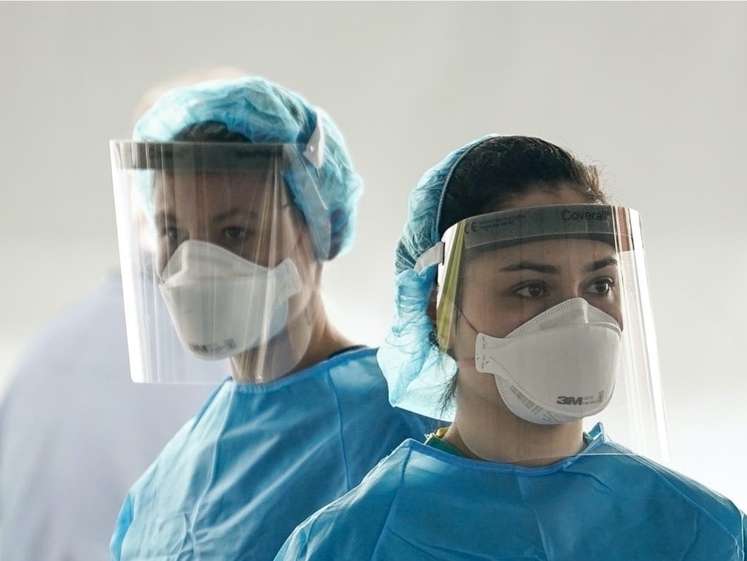 Medical professionals work at a drive-thru coronavirus testing site run by George Washington University Hospital on April 6, 2020 in Washington, D.C.