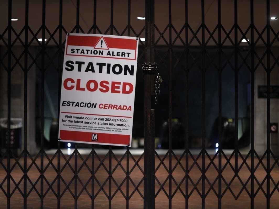 A "Station Closed" sign is hung at the gate of Federal Triangle Metro Station April 7, 2020 in Washington, D.C.