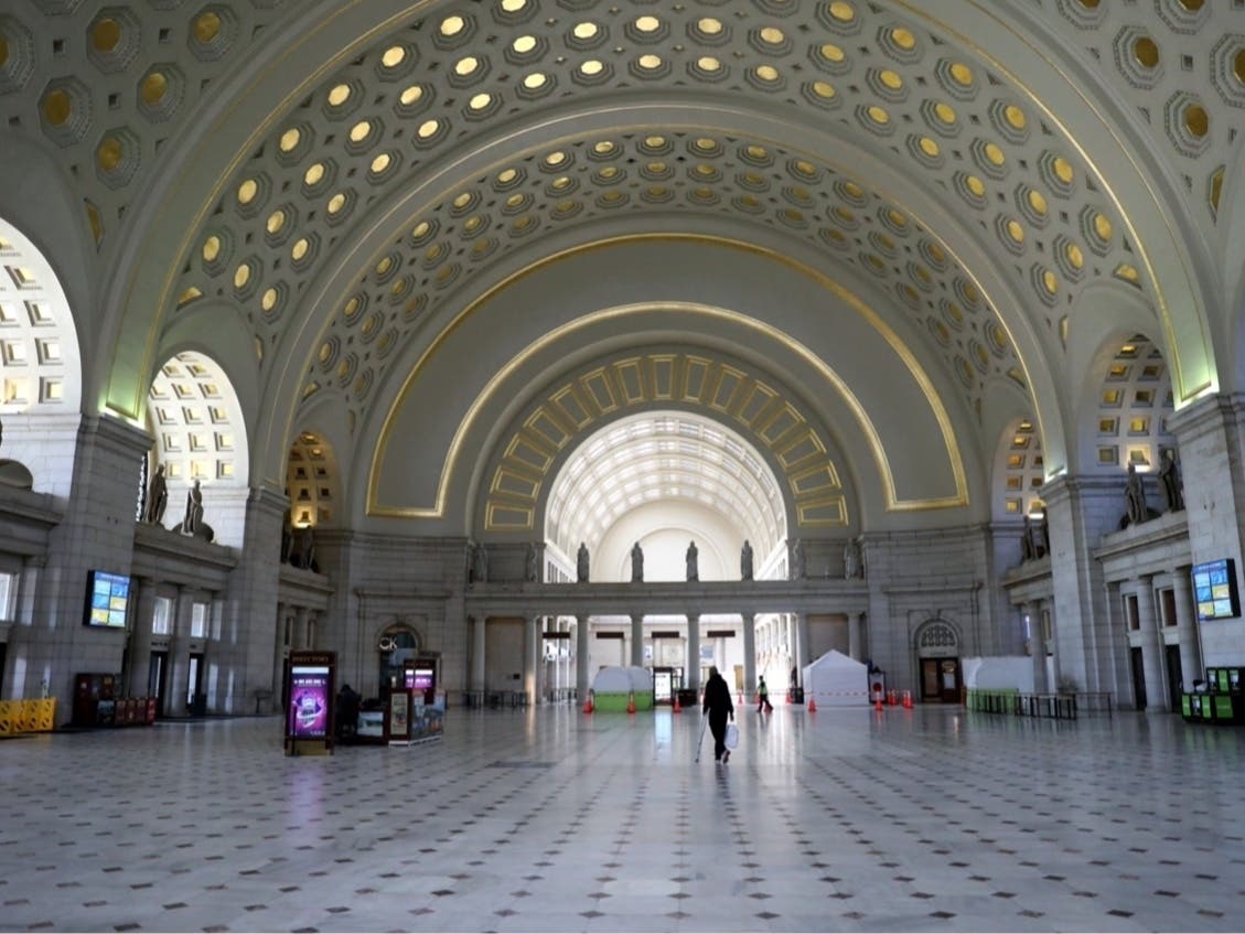  A woman walks through Union Station on April 09 in Washington, D.C. Amtrak and commuter trains have cut daily routes amid the coronavirus (COVID-19) pandemic. 