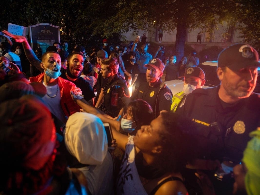 Demonstrators hold a protest near the U.S. Capitol on Friday night in response to the police killing of George Floyd.