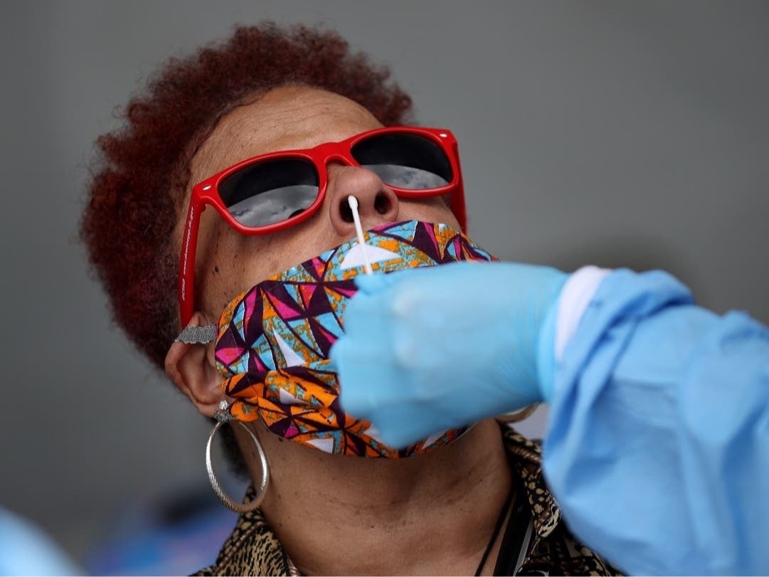 A patient is tested for coronavirus at a testing site in the Anacostia neighborhood June 10, 2020 in Washington, D.C.
