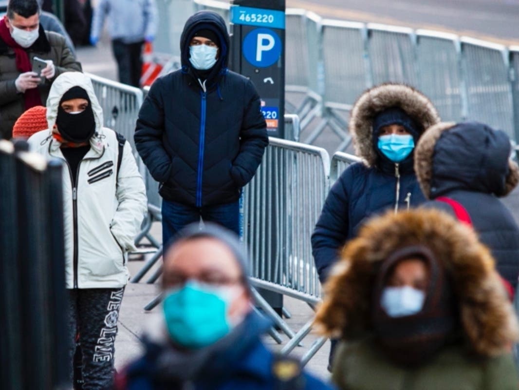 People line up to get a coronavirus test at Elmhurst Hospital on March 24. The hospital was overwhelmed by COVID-19 patients in the pandemic’s 