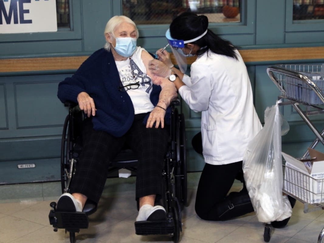 Rhoda Winkelman, a resident at the New Jewish Home in Manhattan, receives the Pfizer-BioNTech COVID-19 vaccine on Dec. 21.