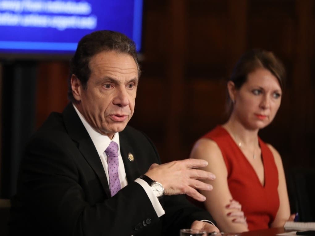 Gov. Andrew Cuomo's top aide Melissa DeRosa, at right, intervened in a state report on the pandemic and stripped out the number of nursing home deaths, according to reports.